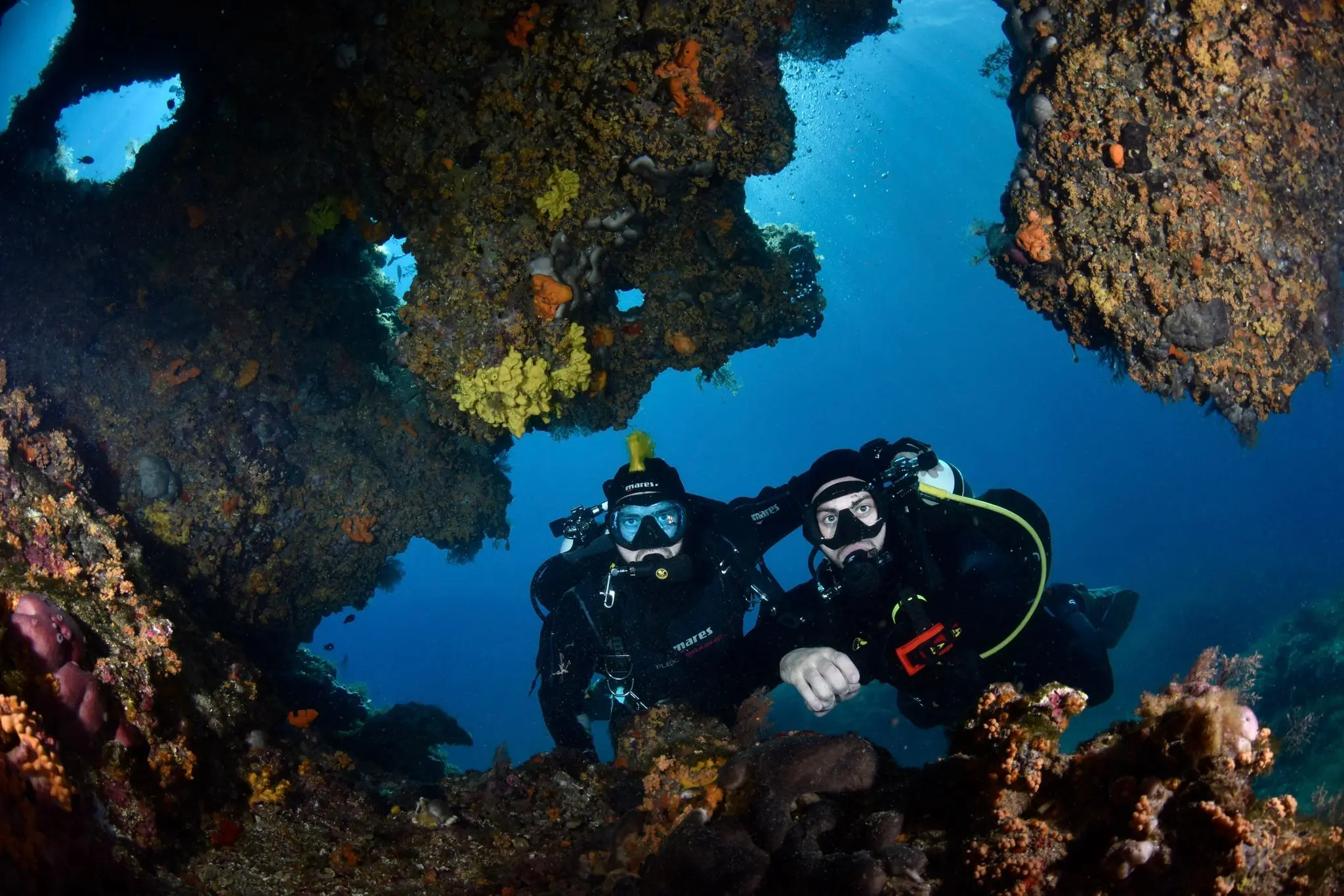 Divers exploring the tunnel